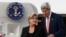 U.S. Secretary of State John Kerry (R) steps off his aircraft alongside Australia's Foreign Minister Julie Bishop in Sydney, August 11, 2014.