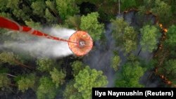 Russia -- burning Taiga wood near the village of Boguchany, about 560 km (348 miles) northeast of Russia's Siberian city of Krasnoyarsk, June 2, 2011