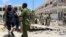 Security forces assist Abdalla Boss, a Somali Member of Parliament who was wounded following a car bomb claimed by al Shabaab Islamist militants outside the president's palace in the Somali capital of Mogadishu, August 30, 2016. 