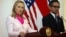 US Secretary of State Hillary Rodham Clinton, left, talks to the media as Indonesian FM Marty Natalegawa listens during a press conference after their meeting in Jakarta, Indonesia, September 3, 2012.