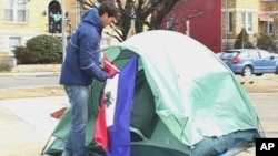 Jesse Sullivan has been camping out in the cold near a busy intersection in Washington to raise awareness for people in Haiti