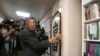 Lam Wing-kee, one of five shareholders and staff at the Causeway Bay Book shop in Hong Kong, hangs his congratulatory gift, Chinese calligraphy that reads: ''Freedom'' at his new book shop on the opening day in Taipei, Taiwan, Saturday, April 25,…