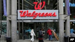 Walgreens retail store in Boston, Massachusetts, June 4, 2014. Walgreen Co. is among many companies considering combining operations with foreign businesses to trim their tax bills.