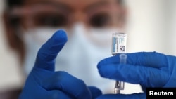 FILE - A nurse draws from a vial of Johnson & Johnson coronavirus vaccine, in Los Angeles, California, March 25, 2021. 