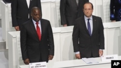 French President Francois Hollande and DRC President Joseph Kabila stand during the opening session of the Francophone Summit, in Kinshasa, DRC, Oct. 13, 2012. 