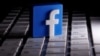A 3D-printed Facebook logo is seen placed on a keyboard in this illustration taken March 25, 2020.