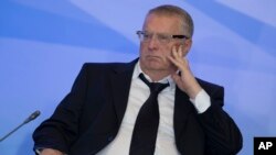 FILE - Russian lawmaker Vladimir Zhirinovsky listens to Russian President Vladimir Putin's address to members of the Crimean parliament.