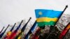 FILE - The national flag of Rwanda flies amongst other flags.