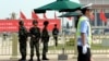 Armed Chinese police stand guard on Tiananmen Square in Beijing, June 3, 2014. 