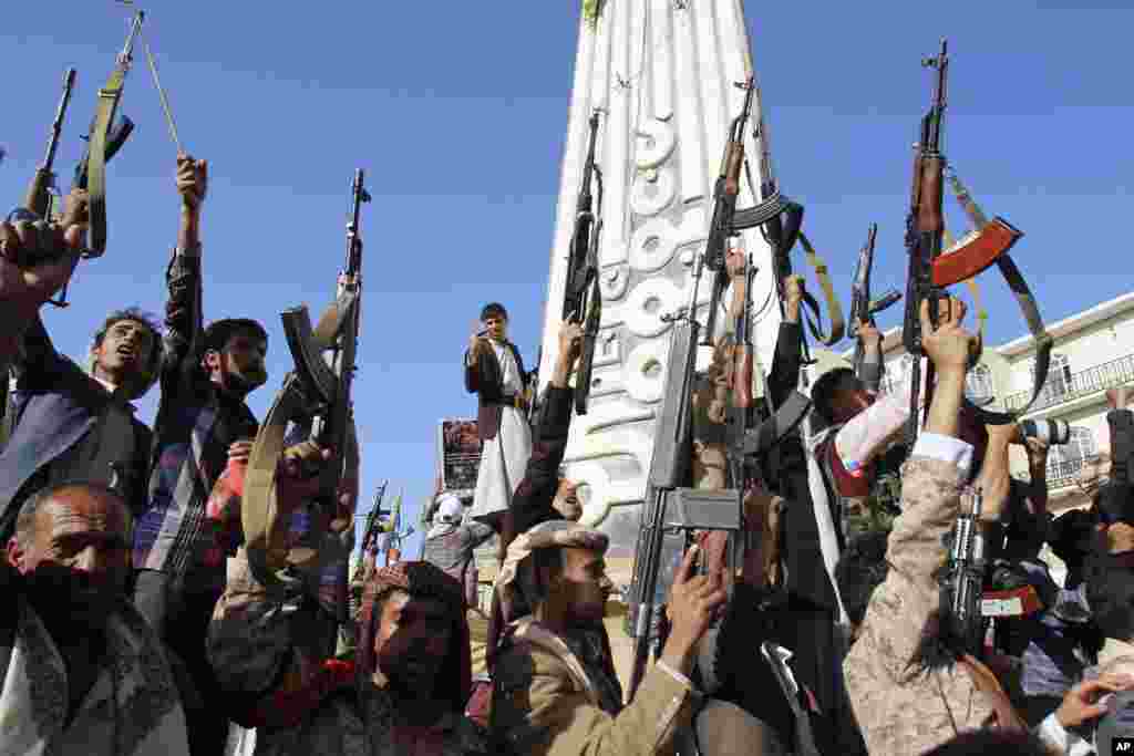 Shiite rebels, known as Houthis, hold their weapons in the air during a demonstration against an arms embargo imposed by the U.N. Security Council on Houthi leaders, in Sana&#39;a, April 16, 2015.