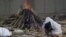 Flames Rise from Funeral Pyres as Indian Families Mourn COVID Victims 