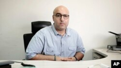 Mohamed Zaree, human rights advocate and legal scholar, poses for a photograph during an interview with The Associated Press in Cairo, Oct. 10, 2017. Ten of the world's leading human rights organizations have selected Zaree for the prestigious Martin Ennals award.