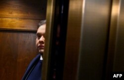 Rep. George Santos, R-NY, takes an elevator while on his way from his office to the US Capitol in Washington, DC, on December 1, 2023. The House voted to expel him later in the day. (Photo by Mandel NGAN / AFP)