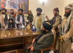 Taliban fighters are seen in Afghanistan's presidential palace after Afghan President Ashraf Ghani fled the country, in Kabul, Afghanistan, Aug. 15, 2021.
