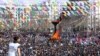 People gather to celebrate Newroz, which marks the arrival of spring and the new year, in Diyarbakir