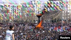 People gather to celebrate Newroz, which marks the arrival of spring and the new year, in Diyarbakir