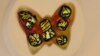 Evelyn Gregory, 11, created this butterfly paperweight under the guidance of fused glass artist Lynda Slayen. (Photo by Gary Sladen)