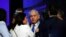 Israeli Prime Minister Benjamin Netanyahu looks on after speaking to supporters at his Likud party headquarters following the announcement of exit polls during Israel's parliamentary election in Tel Aviv, Sept. 18, 2019. 