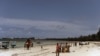 Local tourists walk at the Kenyatta public beach on August 30, 2012, in Mombasa, Kenya.