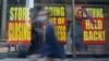 People walk past a business that is closing following the outbreak of COVID-19 in the Manhattan borough, New York, Aug. 17, 2020.