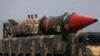 FILE - Pakistani military personnel stand beside a surface-to-surface ballistic missile during a Pakistan Day military parade in Islamabad on March 23, 2019. A White House official said on Dec. 19, 2024, that Pakistan is developing missile capabilities that could reach the U.S.