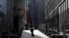 A man walks alone near the World Trade Center in lower Manhattan during the outbreak of the coronavirus disease in New York City, New York, March 27, 2020.