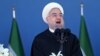 Iran's President Hassan Rouhani speaks at a military parade marking National Army Day in front of the mausoleum of the late revolutionary founder Ayatollah Khomeini, just outside Tehran, April 17, 2016.