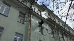 Window Washer by Day, Soccer Player at Night