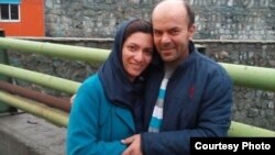 Neda Shabani, an Iranian Baha’i resident of the northern city of Karaj, embraces her husband outside of an Iranian prison after being released on bail Jan. 28, 2019, in this photo sent to VOA Persian by an Iranian Baha’i community member.