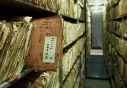 FILE - Files of the former East German Stasi secret service are seen in Berlin, March 7, 2002.