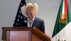 FILE - Ken Salazar, U.S. ambassador to Mexico, speaks to the press after arriving at the Benito Juarez International Airport, in Mexico City, Sept. 11, 2021.