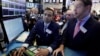 Specialists Dilip Patel, left, and Patrick Murphy work on the floor of the New York Stock Exchange, Jan. 25, 2017. 