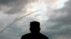 FILE - North Korean leader Kim Jong Un watches the launch of a ballistic missile at an unknown location in North Korea on July 31, 2019, in this screen grab image taken from North Korean broadcaster KCTV. 