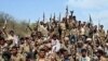 Yemeni soldiers and tribe members after a battle against al-Houthi Shiite rebels in northern Yemen, 24 Jan 2010