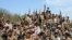 Yemeni soldiers and tribe members after a battle against al-Houthi Shiite rebels in northern Yemen, 24 Jan 2010