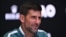 Novak Đoković na konferenciji za novinare u Melburnu (Foto: Lillian SUWANRUMPHA / AFP)