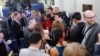 Reporters line up in hopes of attending a briefing in press secretary Sean Spicer's office at the White House in Washington, Feb. 24, 2017. The White House held an off-camera briefing in Spicer's office.