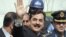Pakistan's Prime Minister Yusuf Raza Gilani waves after arriving at the Supreme Court in Islamabad, April 26, 2012.