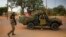 French soldiers stand at a crossroads as they arrive in the city of Sevare, about 620 kilometers north of Bamako, Mali, January 25, 2013.