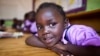 FILE - A four-year-old deaf student sits inside her classroom in the specialized deaf unit program at the Little Rock Inclusive Early Childhood Development Center in Kenya's capital Nairobi.