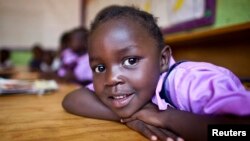 FILE - A four-year-old deaf student sits inside her classroom in the specialized deaf unit program at the Little Rock Inclusive Early Childhood Development Center in Kenya's capital Nairobi.
