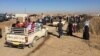 Many arriving families found relatives either in the camp or waiting in the parking lot, after more than two years of separation on Nov. 3, 2016, at the Khazir camp in Kurdish Iraq. (H. Murdock/VOA)