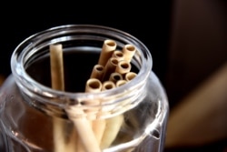 Bamboo straws are stored in a jar on a table at the Copacabana restaurant on Yoff Virage beach in Dakar, Senegal, Sept. 3, 2019.
