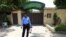 A policeman stands guard outside the Save the Children charity's office in Islamabad, Pakistan, June 12, 2015.