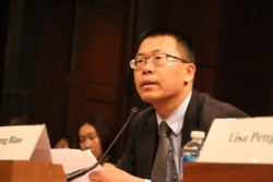 资料照： 维权律师滕彪在国会作证（美国之音杨晨拍摄）