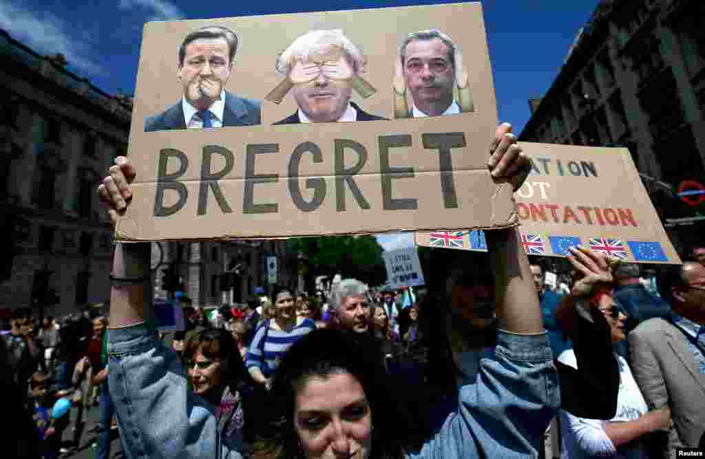 People hold banners during a &#39;March for Europe&#39; demonstration against Britain&#39;s decision to leave the European Union, in central London, Britain, July 2, 2016.