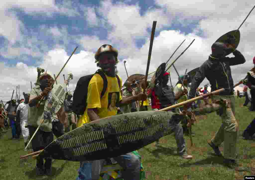 A Zulu man sings and dances after the funeral of Nelson Mandela in Qunu, Dec. 15, 2013.&nbsp;