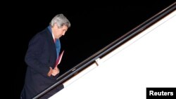 Dominika and Bartek Mieczkowski, A recently-married couple from Poland, embrace near grills covered with &quot;love locks&quot; on a walkway which leads to the Pont de Arts over the River Seine in Paris, France.