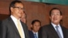 Cambodian Prime Minister Hun Sen, right, talks with the main Opposition Party leader Sam Rainsy, left, of Cambodia National Rescue Party, after their meeting in Senate headquarters in Phnom Penh, Cambodia, July 22, 2012. 