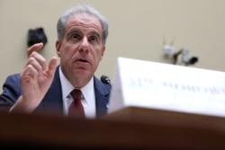 FILE - U.S. Justice Department Inspector General Michael Horowitz testifies before the House Oversight and Government Reform Committee on Capitol Hill in Washington, Sept. 18, 2019.